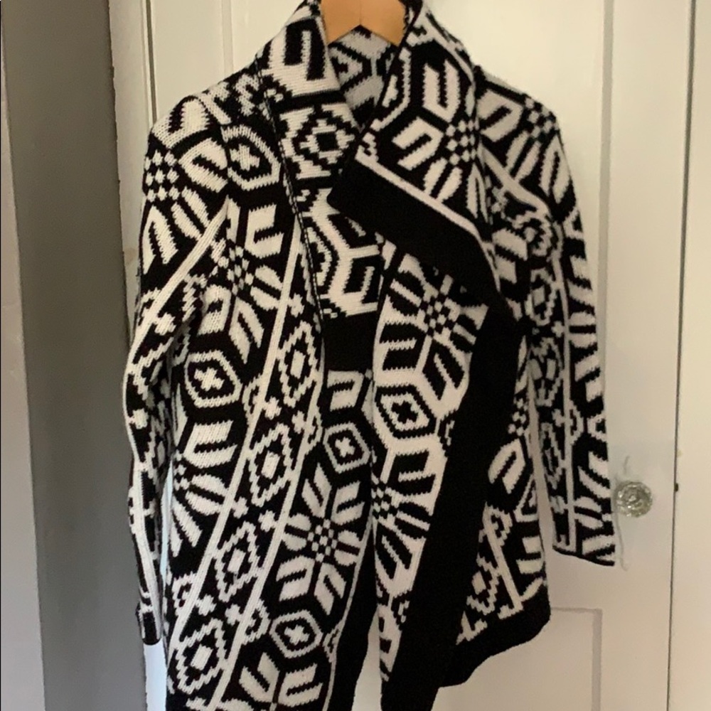 Sleeved poncho style sweater
